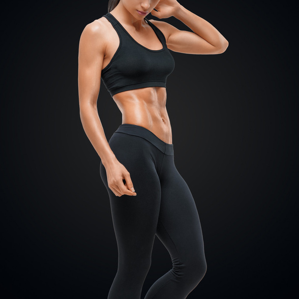 Fitness sporty woman showing her well trained body - Fotografie, Obrázek