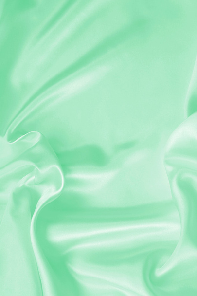 Smooth elegant green silk or satin texture as background - Photo, image