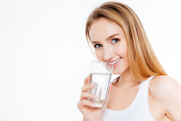Pretty woman drinking water  - Фото, изображение