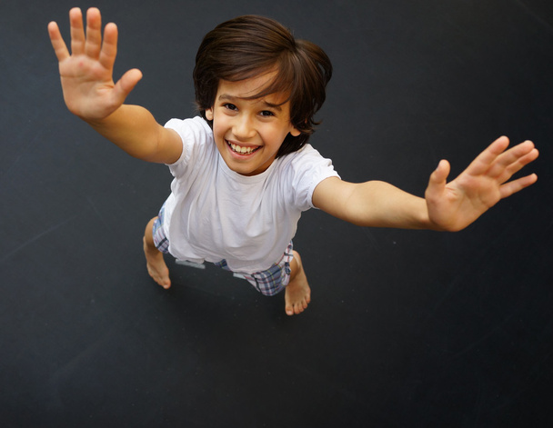Kid jumping high up - Zdjęcie, obraz