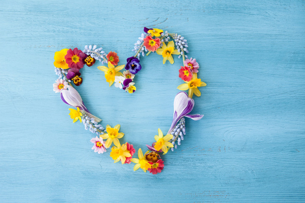 Spring flowers in a hearts shape - Фото, зображення