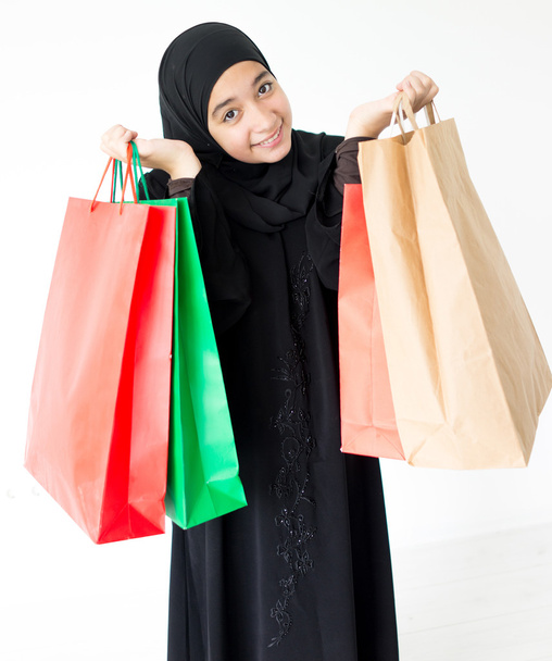 Arabic Muslim girl with shopping bags - Φωτογραφία, εικόνα