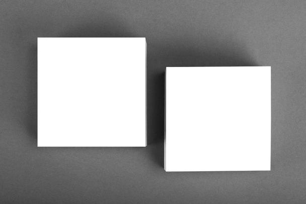 Collection of white note papers on gray background. - Foto, Bild
