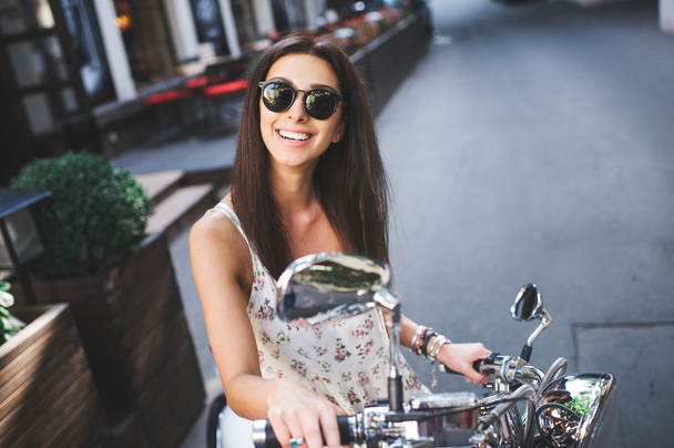 young attractive girl on scooter - Photo, image