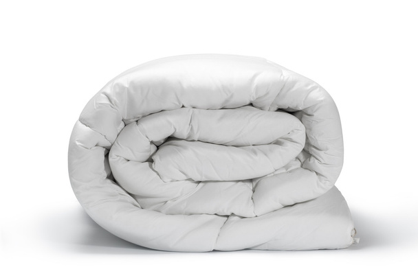 Warm and confortable folded white quilt - Photo, Image