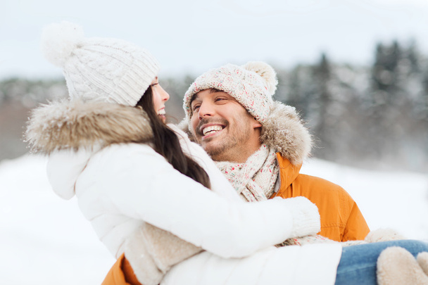 happy couple outdoors in winter - Фото, изображение