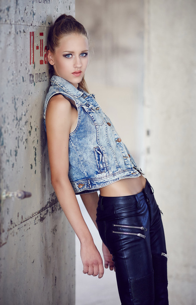 Blue eyes young woman in denim jacket. - Photo, Image