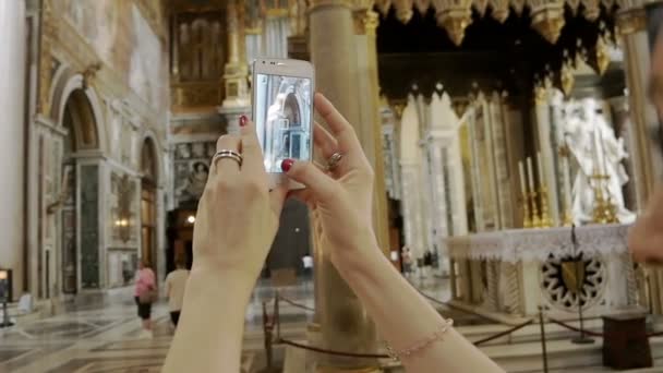 woman taking photos inside Cathedral in Rome:  smartphone, church, monuments - Footage, Video