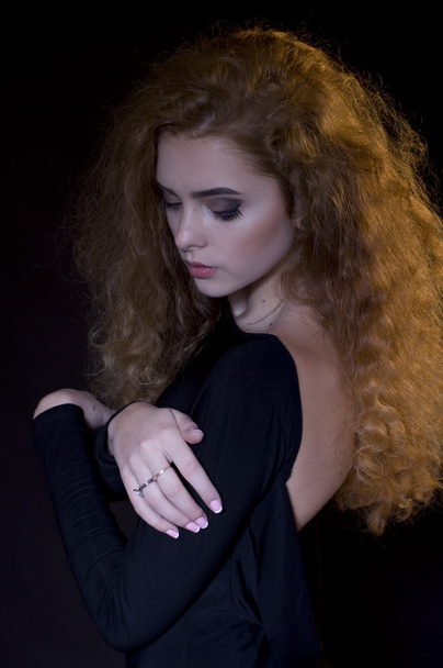 studio portrait of beautiful young model on black background - Zdjęcie, obraz