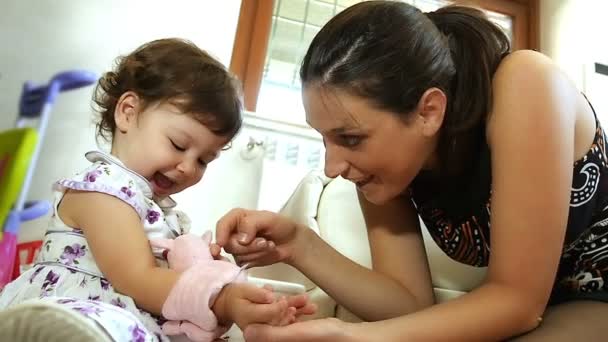 mom and daughter playing with little peluche - Footage, Video