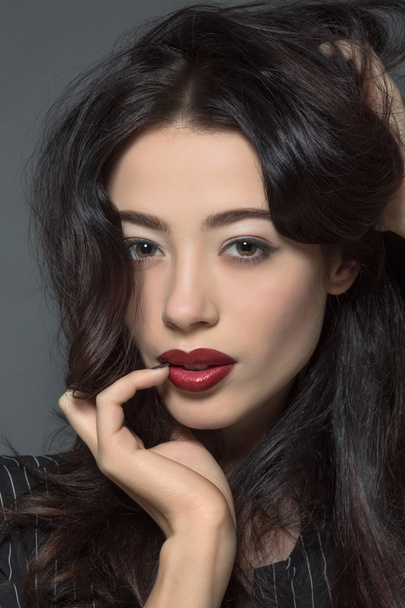 Fashion model woman with dark red lips in studio - Foto, Imagen