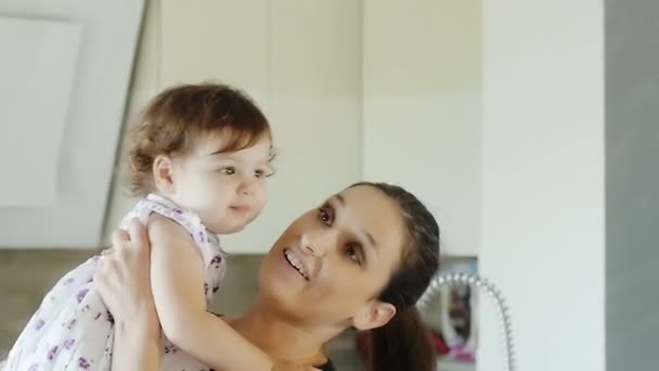 mother having tender moments with her baby daughter - Video, Çekim