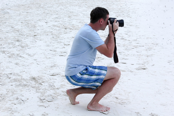 fotograaf foto's nemen op het strand - Foto, afbeelding