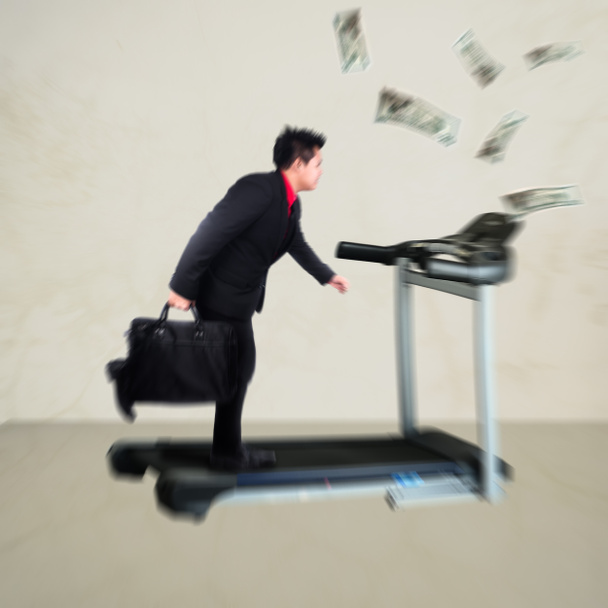 Blur background Businessman with a briefcase running on treadmil - Photo, Image
