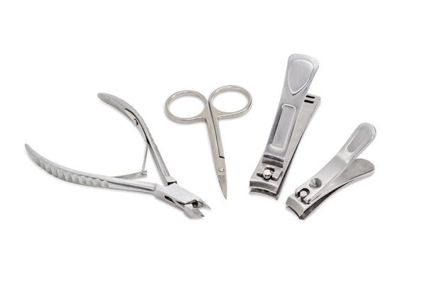 Three nail clippers different types and sizes and nail scissors - Photo, Image