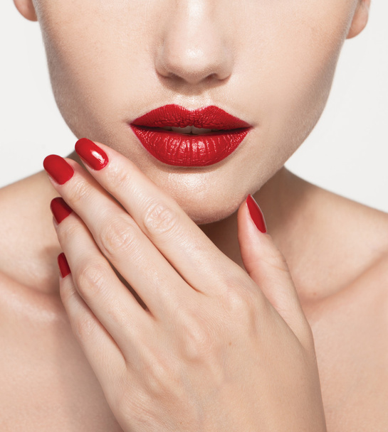 model with red lips and red manicure - Фото, изображение