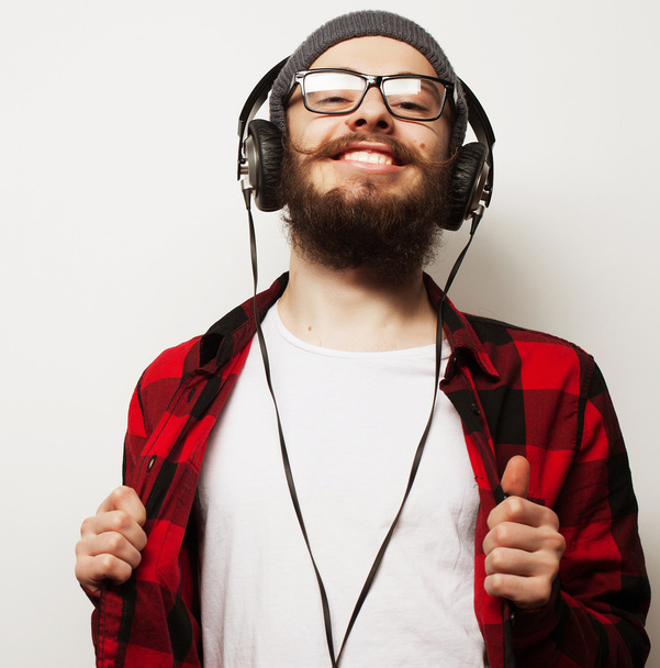 young bearded man listening to music - Фото, изображение