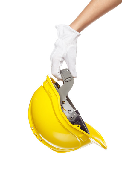 Construction helmet in the hand, isolated - Photo, Image