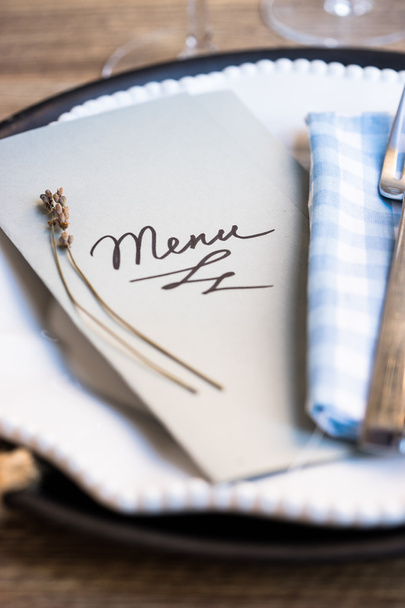 Restaurant table setting with menu and utensils - Photo, Image