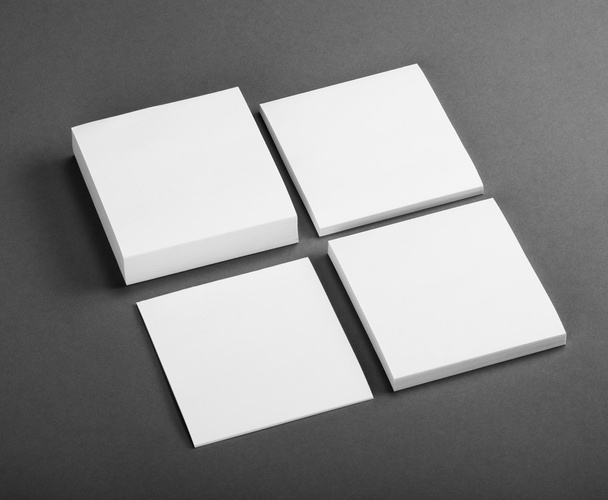 Collection of white note papers on gray background. - Foto, immagini