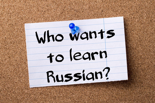 Who wants to learn Russian? - teared note paper pinned on bullet - Zdjęcie, obraz