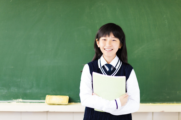 ευτυχισμένος φοιτητής κορίτσι με βιβλίο στην τάξη - Φωτογραφία, εικόνα