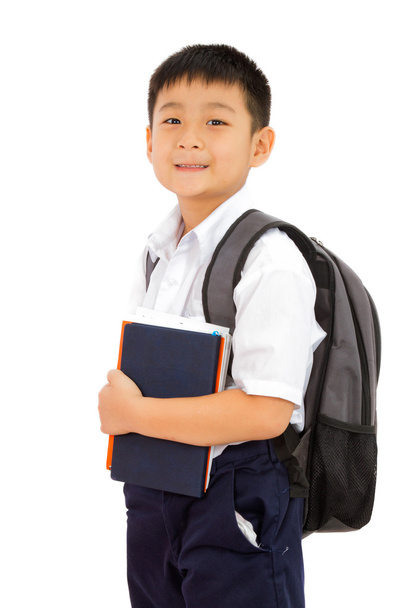 Asian Little School Boy Holding Books with Backpack on White Bac - Фото, изображение