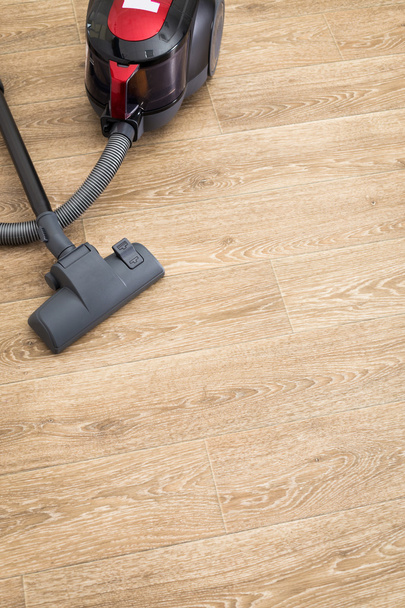 Cleaning of the apartment. Vacuum cleaner on the floor - 写真・画像