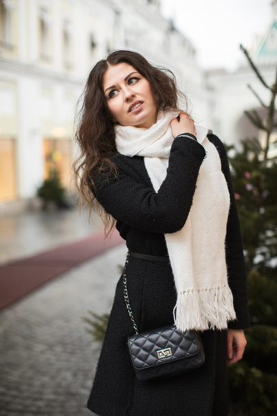 Portrait woman with long curly hair posing outdoors.  - Fotó, kép