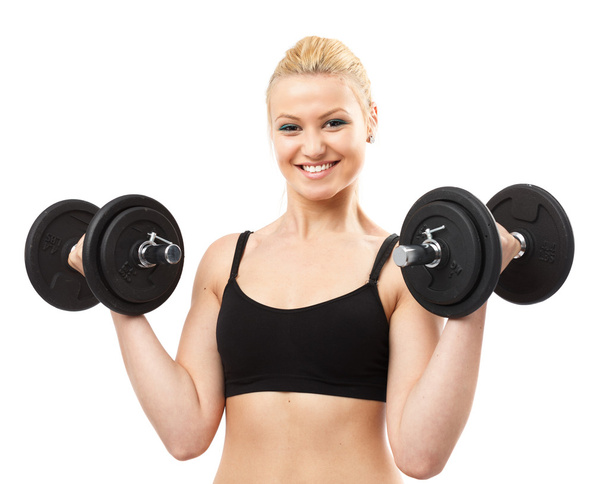 Athletic young lady working out with weights - Foto, immagini