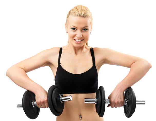 Athletic young lady working out with weights - Foto, imagen