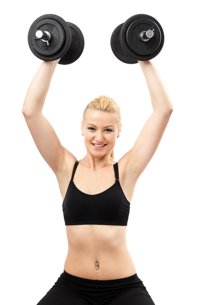 Athletic young lady working out with weights - Foto, Imagen