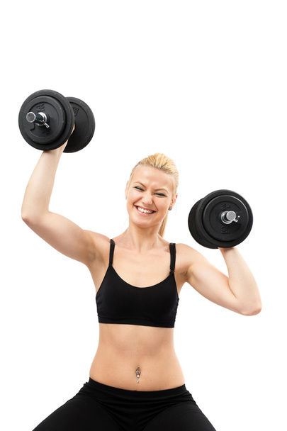 Athletic young lady working out with weights - Fotoğraf, Görsel