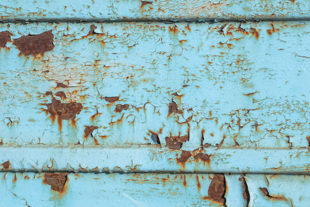 corrugated iron surface is covered with old paint texture background - Фото, изображение