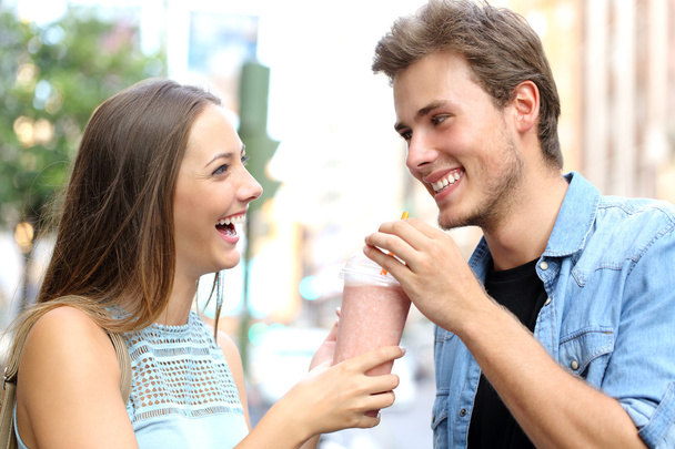 Couple or friends sharing a milkshake - Fotografie, Obrázek