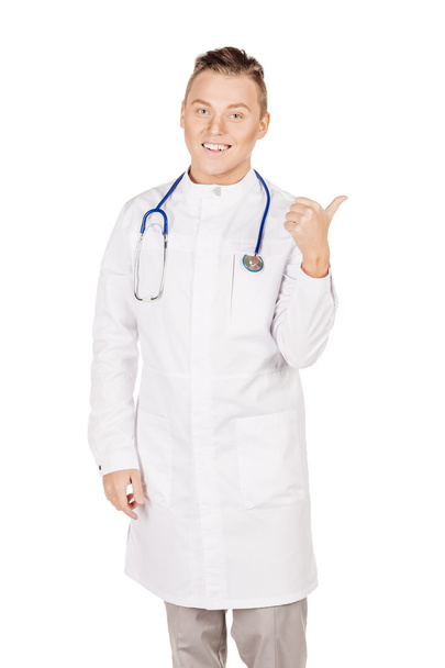 Young  male doctor in white coat and stethoscope finger point up - Zdjęcie, obraz