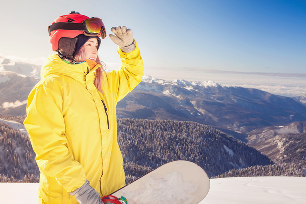 Snowboarder girl on the background of high mountain Alps, Switzerland - 写真・画像
