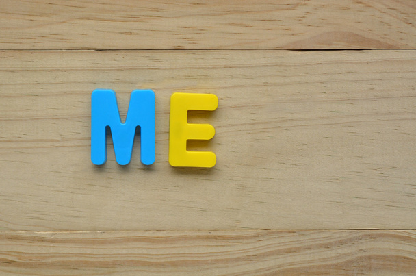 Top lay of the word Me on a wooden background - Photo, Image