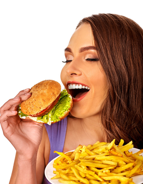 Девушка ест большой бутерброд
. - Фото, изображение