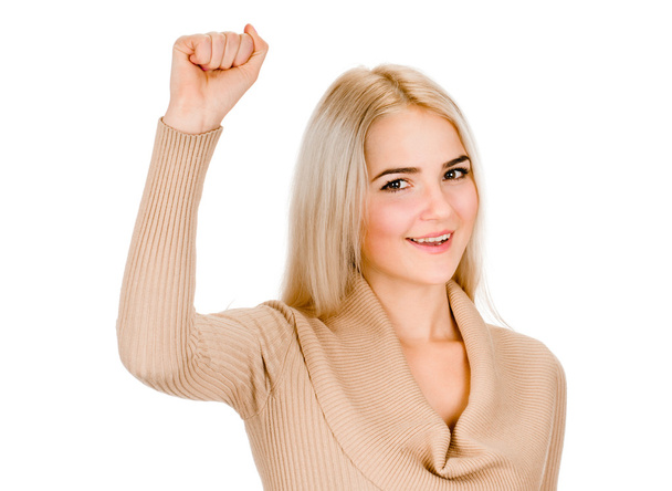 Mujer joven saliendo levantando el puño apretado brazo
 - Foto, Imagen