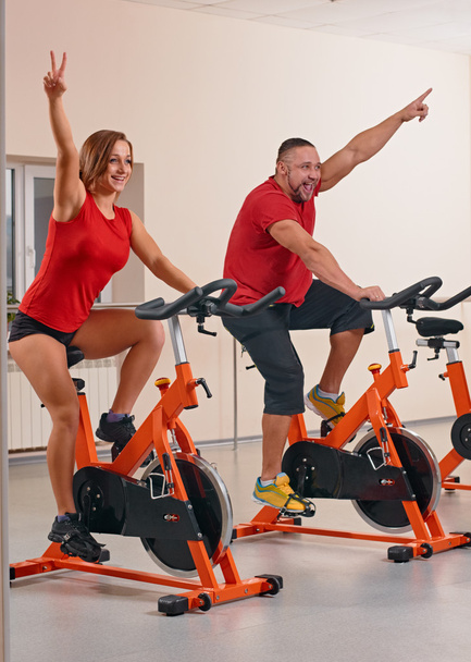 Indoor bycicle cycling in gym - Photo, Image