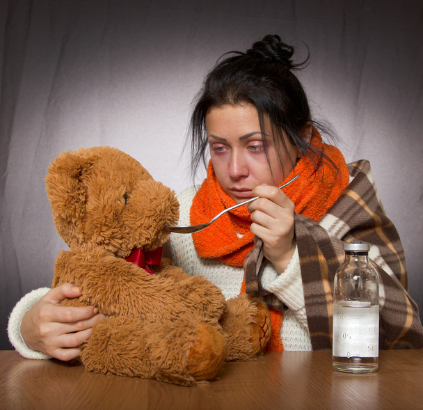 woman giving medicine bear against influenza - Photo, Image