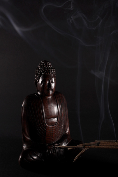 Wooden Buddha meditating - 写真・画像