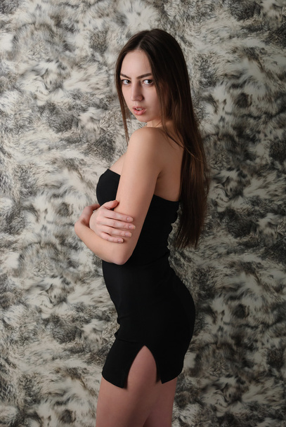gorgeous slim girl in black short dress - Foto, Imagen