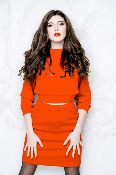Model with long hair in red dress - Valokuva, kuva