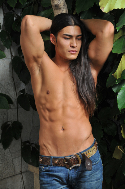 Male model in tropical greenhouse - Foto, Imagen