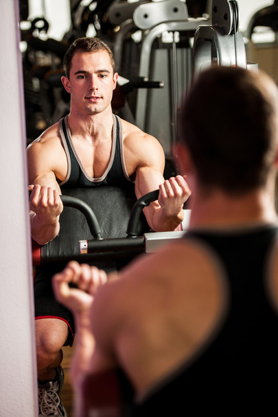 Handsom young man workout in fitness gym  - Photo, Image