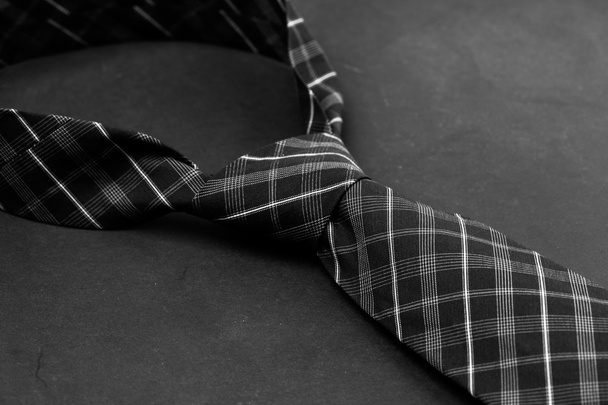 Man's tie on dark background - 写真・画像