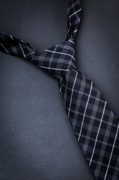 Man's tie on dark background - 写真・画像