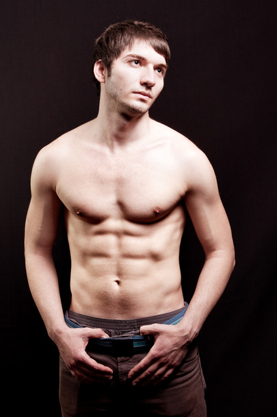 Shirtless young man with sexy abdomen - Fotoğraf, Görsel